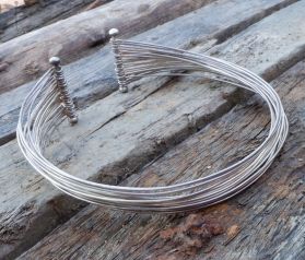 Handcrafted Fine Hill tribe Silver traditional Karen choker.
A comfortable necklace that is Timeless in design twisted
with a modern edge.